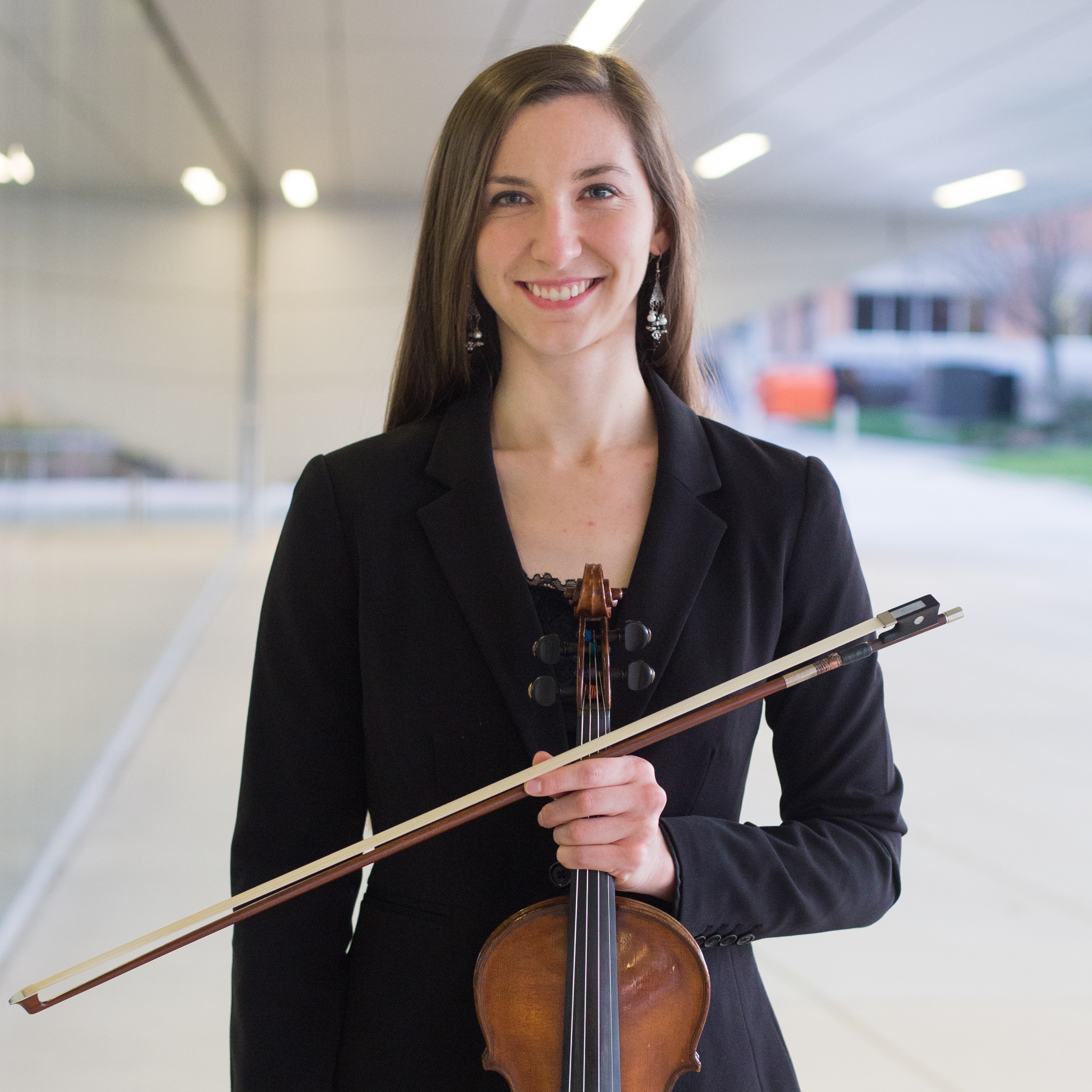 Picture of Brandi Main holding her violin